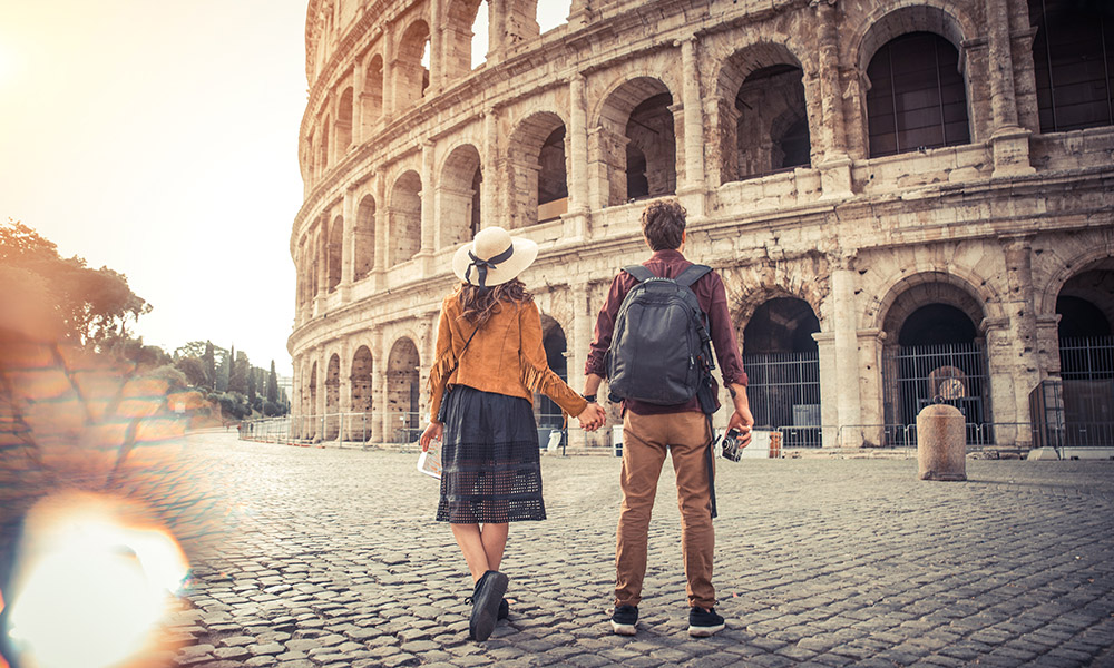 Couple standing at the Colosseum