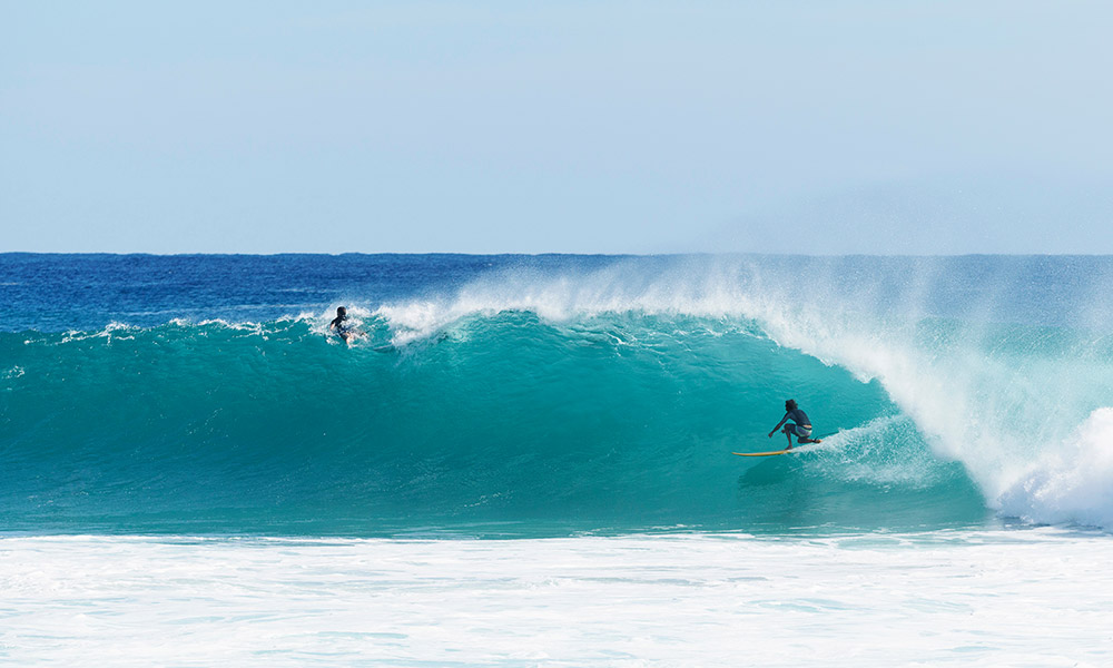 Surfers at Kirra Beach, QLD. 