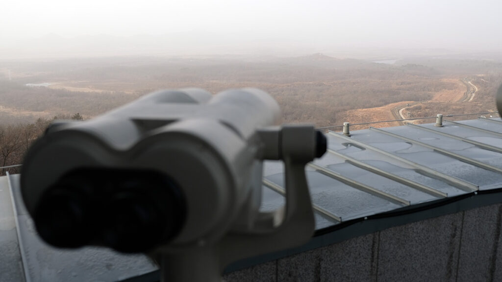 Free binoculars on the rooftop of Dora Observatory allow a deeper look into North Korea.