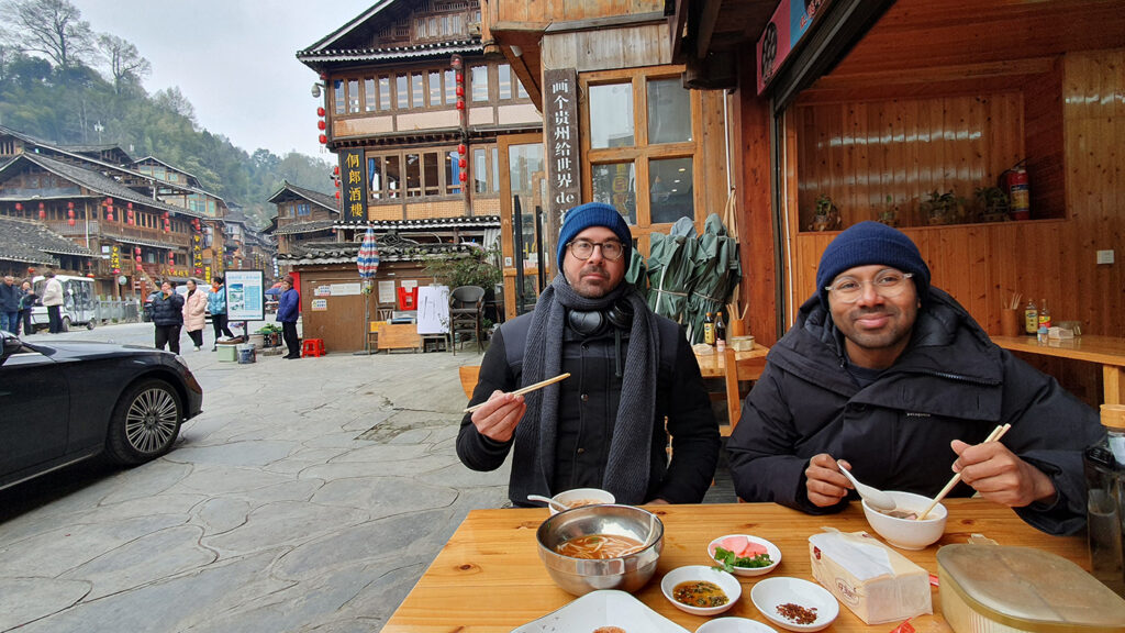 Tour guests enjoying local cuisine in Guizhou. Credit: Off the Eaten Track. 